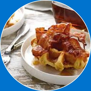 “Waffle topped with crispy bacon and maple syrup.”