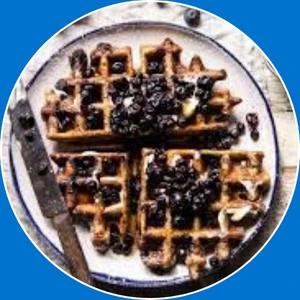 “Waffle topped with a mix of fresh berries.”