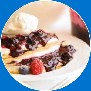 “Crepe filled with cheesecake and mixed berries.”