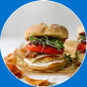 “Burger with chicken, crispy bacon, and ranch sauce.”