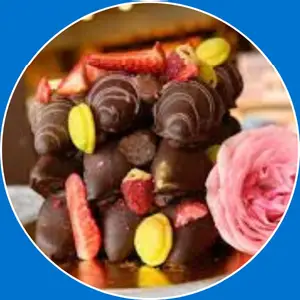 “Layered chocolate pancakes topped with fresh strawberries.”