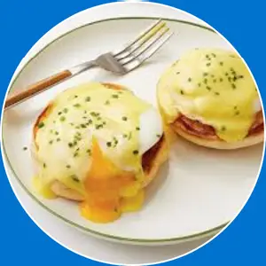 “Classic Eggs Benedict with poached eggs and hollandaise sauce.”