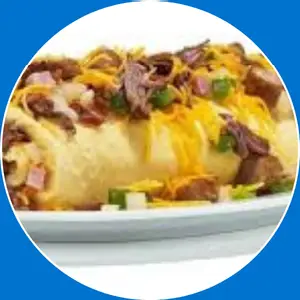 “Omelette filled with ham, peppers, onions, and cheese.”