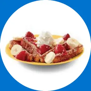 “French toast topped with cream cheese and strawberries.”