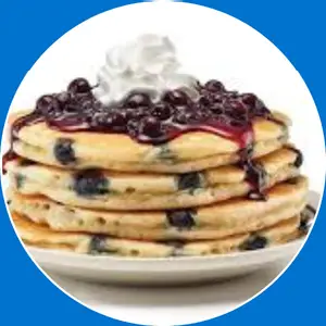 “Pancakes loaded with fresh blueberries.”