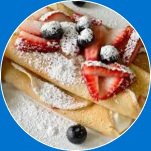 “Crepe filled with cheesecake and fresh berries.”
