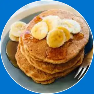 “Whole-grain pancakes made with wholesome grains, served fluffy and golden with syrup and butter.”