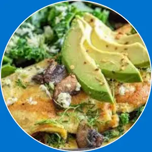 “Garden veggie omelette made with fresh vegetables like bell peppers, onions, and spinach, folded into a fluffy omelette.”