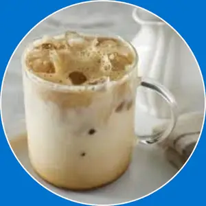 “Glass filled with iced coffee and ice cubes.”