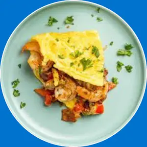 Custom omelette made with choice of fresh fillings like cheese, vegetables, and meats, cooked to a fluffy finish.