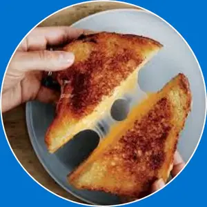 : “Grilled cheese sandwich with melted cheese between golden, buttery toasted bread slices.”