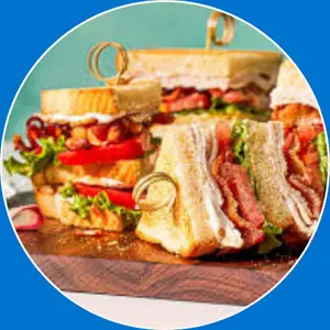 “Turkey club sandwich with bacon, lettuce, tomato, and mayo.”