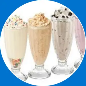 “Peanut butter cup milkshake topped with whipped cream and chocolate drizzle.”