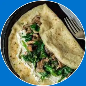 “Savory crepe filled with spinach and mushrooms.”