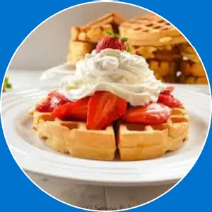 “Crispy waffle topped with fresh strawberries and cream.”