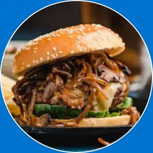 “Burger topped with sautéed mushrooms and Swiss cheese.”